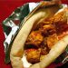 Foil-wrapped pita filled with chicken and yogurt sauce.