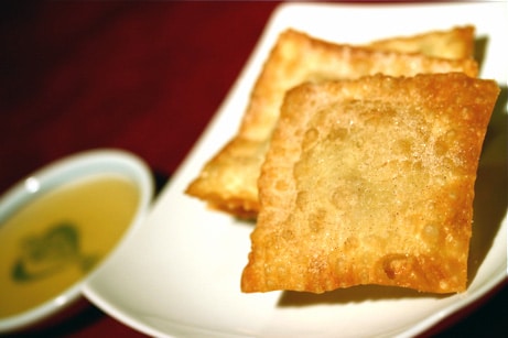 Deep fried ravioli on a plate.