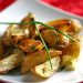 A plate of roasted new potatoes with chives.