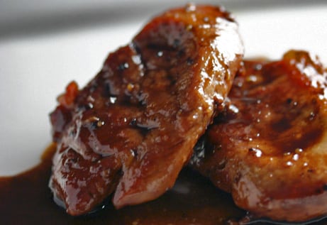 Close-up of glazed pork medallions.