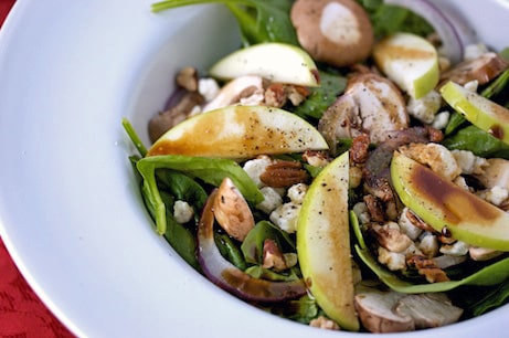 Bowl of salad with pears and gorgonzola.