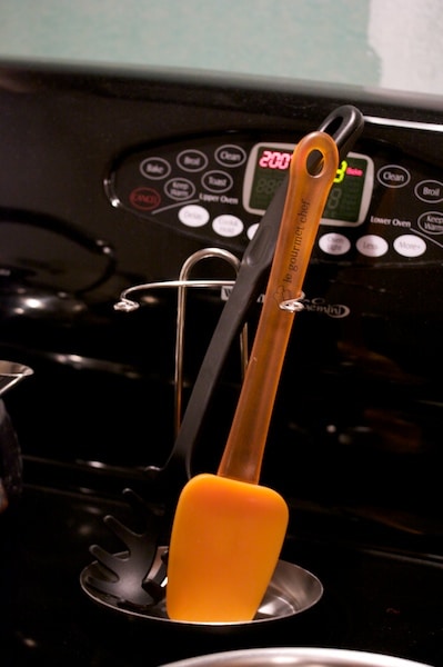 Stovetop with cooking utensils.