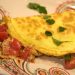Omelette with tomatoes on a plate.