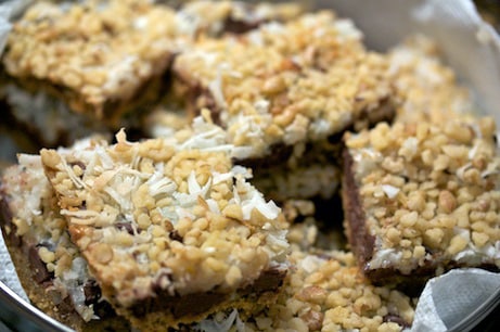 Magic cookie bar squares in a pile.