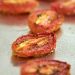 Oven-roasted tomatoes on a baking sheet.