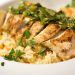Sliced chicken over rice.