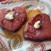 Heart-shaped red velvet pancakes on a plate.