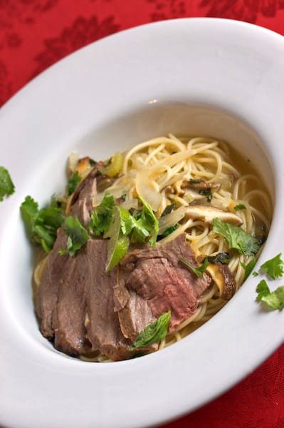 Steak and noodle soup.