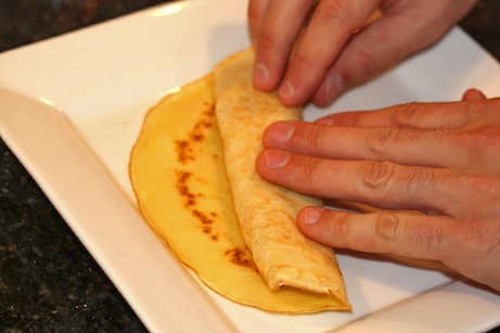 Rolling a crepe.