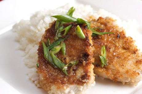 Breaded pork chops with rice.