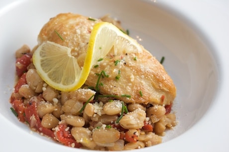 Chicken and lemon over white beans.