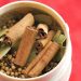 Whole spices in a spice grinder.