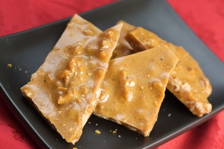 Walnut brittle on a plate.