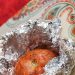 Tomato cooked in aluminum foil.