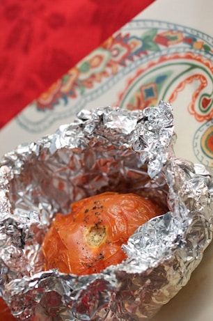 Tomato cooked in aluminum foil.