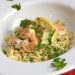 Bowl of shrimp over orzo.