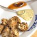 Chicken nuggets with dipping sauces on a plate.