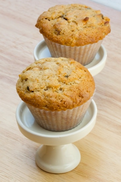 Carrot spice muffins on mini cake stands.