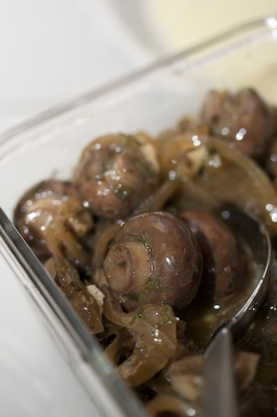 Close-up of marinated mushrooms.