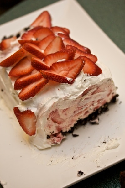 Ice cream cake topped with strawberries.