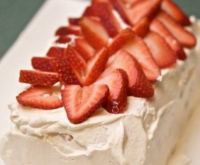 Ice cream cake topped with strawberries.