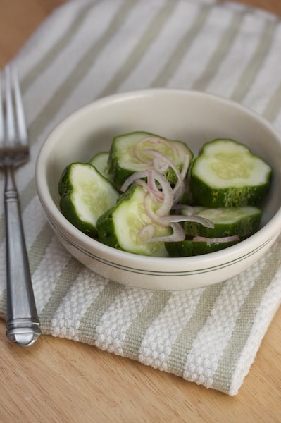 Bowl of cucumber and shallots.