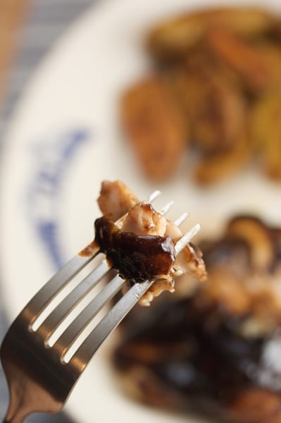 Chicken with balsamic BBQ sauce on a fork.