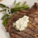 Grilled steak topped with compound butter.