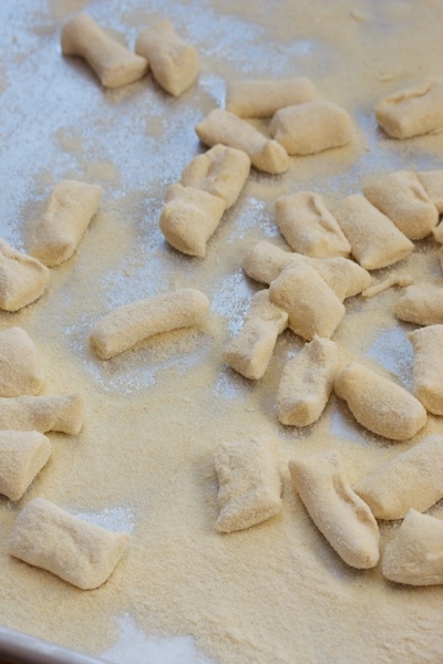 Fresh uncooked cavatelli pasta on a baking sheet.