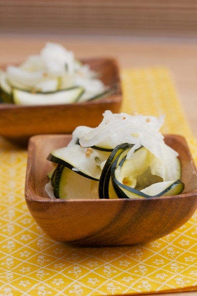 Small bowls of pickled zucchini.