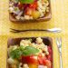 Small bowls of tomato-corn salad with fresh basil.