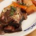 Short ribs with red wine sauce and root vegetables.