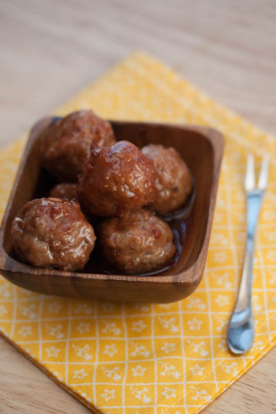 Bowl full of mini sweet and sour meatballs.