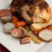 Roast chicken and root vegetables on a plate.
