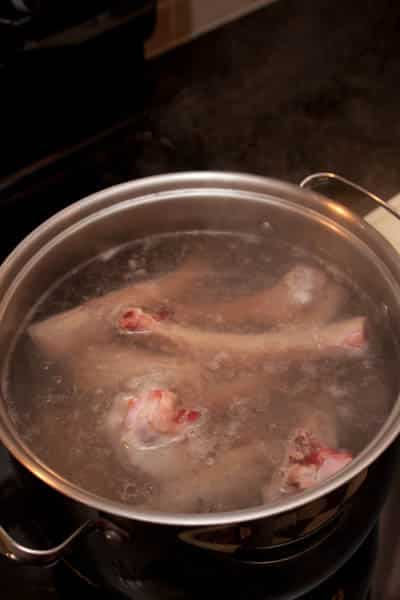 Boiling water with beef bones.