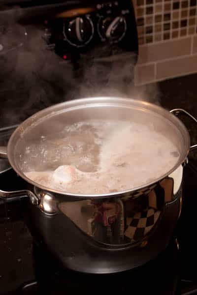 Boiling water with beef bones.