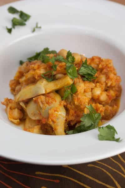 Bowl of chickpea and artichoke masala.