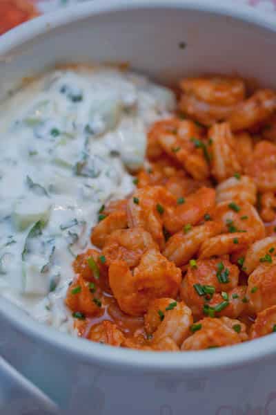 Close-up of spicy Thai shrimp with mint raita.