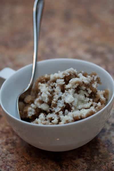 Thai dessert in a mug with a spoon.