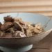 A bowl of marinated mushrooms and onions.