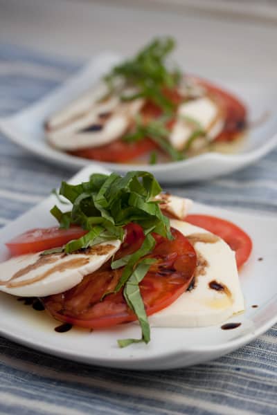 Caprese salad on small plates.