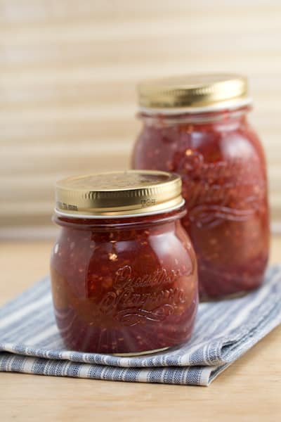 Jars full of rhubarb-raspberry jam.