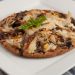 A pizza sitting on a plate.