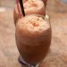 Mocha floats in glasses with spoons and straws.