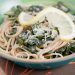 Spaghetti with braised kale and lemon in a bowl.
