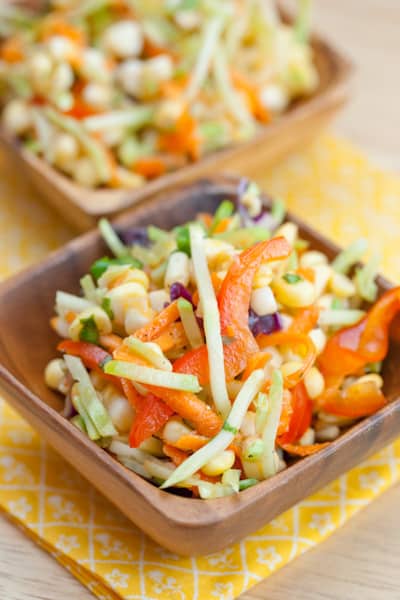 Small dishes of cabbage and corn slaw.