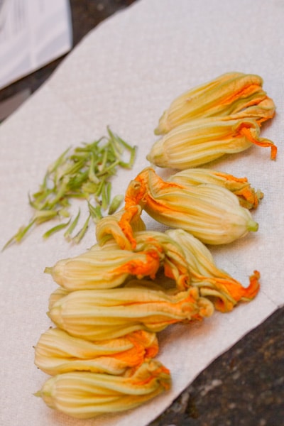 Squash blossoms being cleaned.