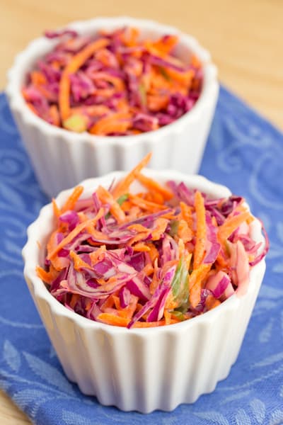 Two ramekins of rainbow cole slaw.