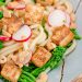 Udon noodles with tofu, broccolini, and radishes.