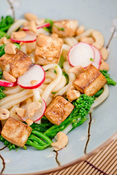 Udon noodles with tofu, broccolini, and radishes.